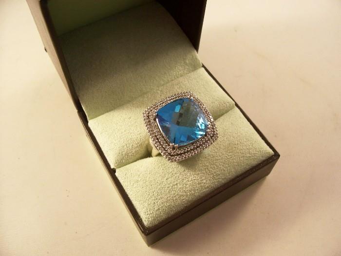 From Ross Simons jewelers - 18.5 carat blue topaz and diamond ring in 14kt white gold - size 8.  Fantasy cut stone - it's a STUNNER!