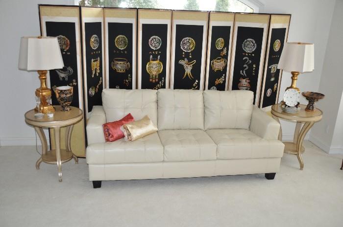 Beautiful Asian inspired living room with Samuel Ivory leather sofa by Coaster Fine Furniture.