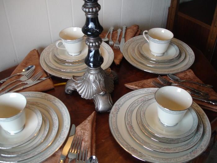 40 piece china service with silver.  Dinner plate, salad, bread, cup, and saucer.  Pattern Charleston by Lenox