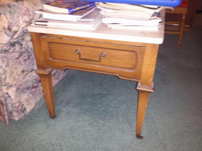 REAL MARBLE TOP. ONE END TABLE HAS THE DRAWER, THE OTHER ONE DOES NOT BUT THEY DO MATCH AND BOTH HAVE MARBLE TOPS
