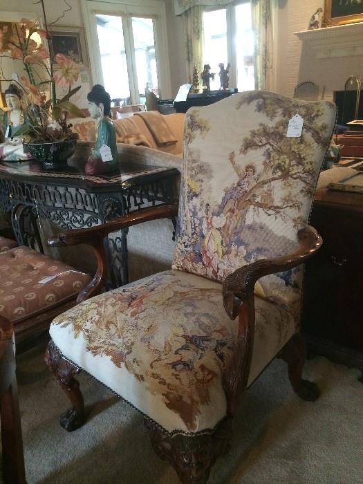    One of two intricately carved French arm chairs; inlaid marble sofa table has matching cocktail table.