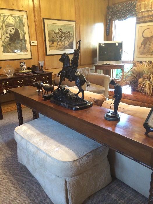    Extra long spool leg sofa table; ottoman; sculptured Native American; golf sculpture;