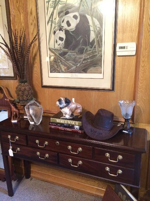   Sofa table; feathered arrangement; John A Ruthven framed Safari Series pandas; Australian hat
