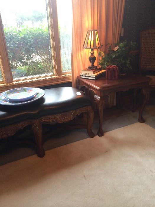    Carved wood/leather bed bench; end table; one of many lamps