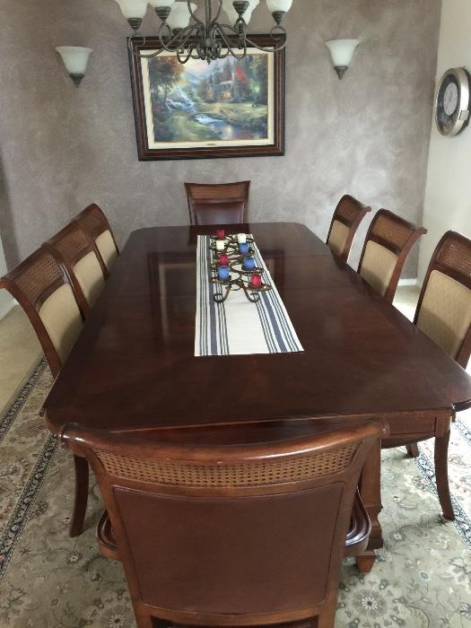 Formal dining room table with 8 chairs. Good condition.
