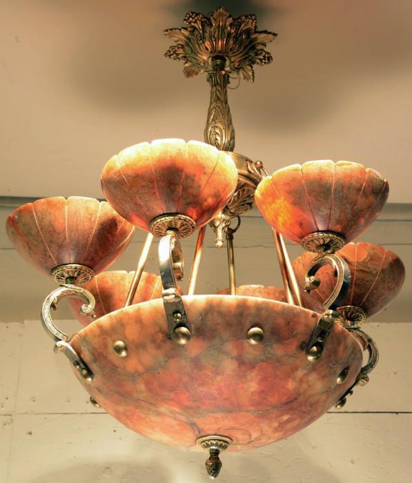 French art deco style bronze and red alabaster chandelier with six arms extending up from center globe. ca. 1910. 26" t x 24" w