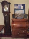 Ridgeway grandfather clock and oak roll top desk. 