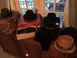 Fine collection of quality name brand hats. Some from Meyer the Hatter. Also a Russian mink hat. 
