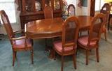 Double pedestal table with four side chairs and two arm chairs