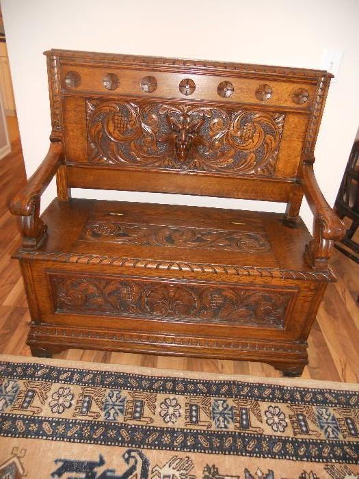 Highly carved Oak hall storage bench with Gargoyle face