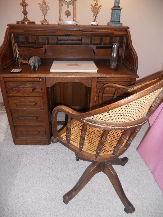 S top antique oak roll top desk and an antique oak desk chair