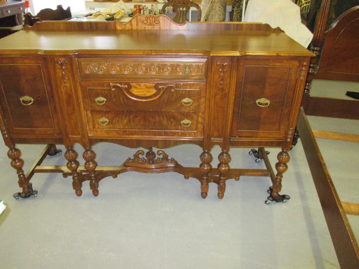 Carved Side Board in Excellent Condition . Original Pulls . Solid Wood . Straight out of Estate Home site. 