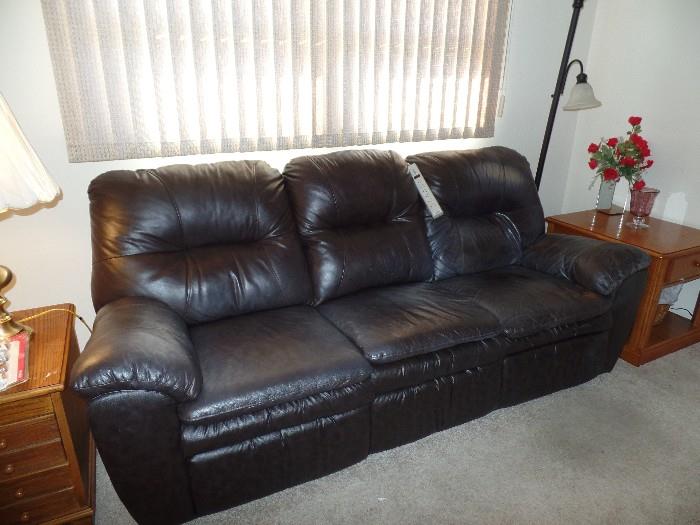 Leather Couch-. Both ends recline
