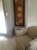 swivel chair and nice piece of wall art