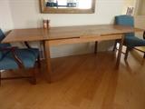 Teak table, extensions fold under table