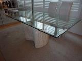 Glass top table with contemporary pedastal