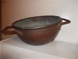 Large old copper pot with wrought handles
