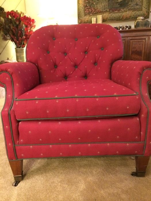 Button-back red tufted chair with sage green piping