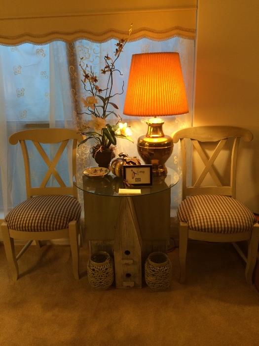 Pair of X-back chairs with birdhouse lamp table