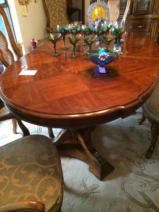 Oval parquetry dining table with two leaves.