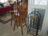 Nice swivel bar stools and wine rack.