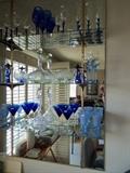 Beautiful glass and crystal. On the middle shelf, rare Murano Asian couple figurines.