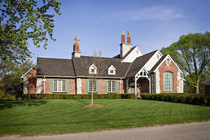 3400 sq ft. cottage style home all brick, stone , cedar. Stunning view of golf course sitting on a hill. $599,000