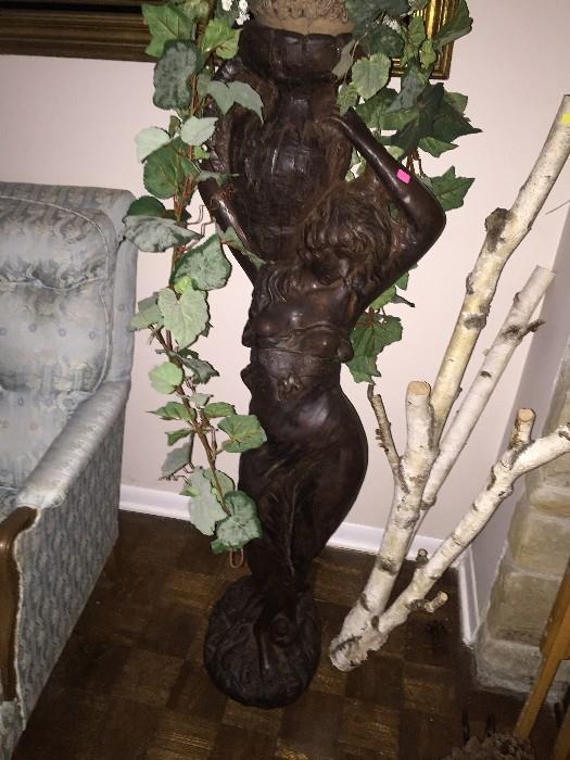 CLAY STATUE HOLDING BASKET WITH GREEN VINES