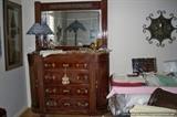 Austrian dresser, linens, reflections of metal palm tree lamp