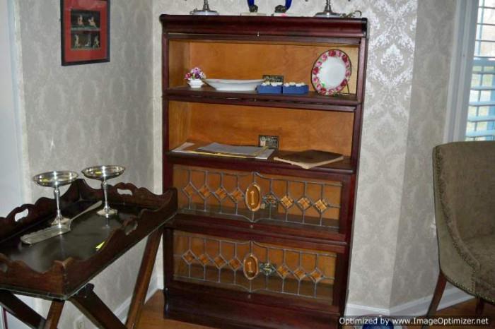 Leaded glass lawyer's bookcase and antique English serving tray with stand