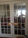 Interior double French doors, just a few of the many doors available for sale in this home. 