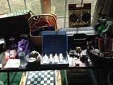 Miscellaneous items including a camping stove, jewelry, tools, and more. 