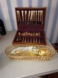 Gold-tone flatware and serving pieces from Macys, brand new in box. 