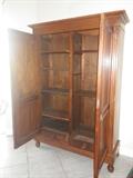 Armoire inside with shelves and bottom drawers