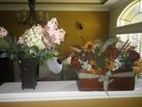 Two of many artificial flower arrangements