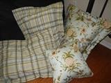 Throw pillows from the linen set that includes quilt, skirt, sheets etch