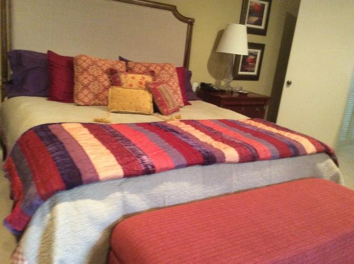 The bench at the end of the bed was removed by family. Nice king sized bed with upholstered head board. I think it is a tempurpedic mattress.