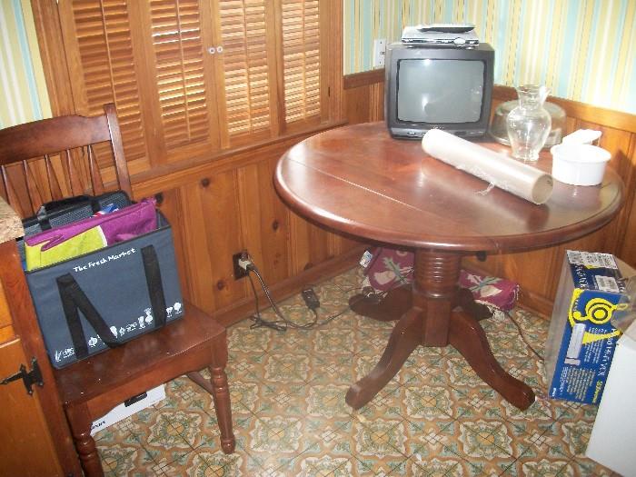kithen table with one of the two chairs