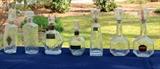 Antique liquor bottles, many with embossed makers mark