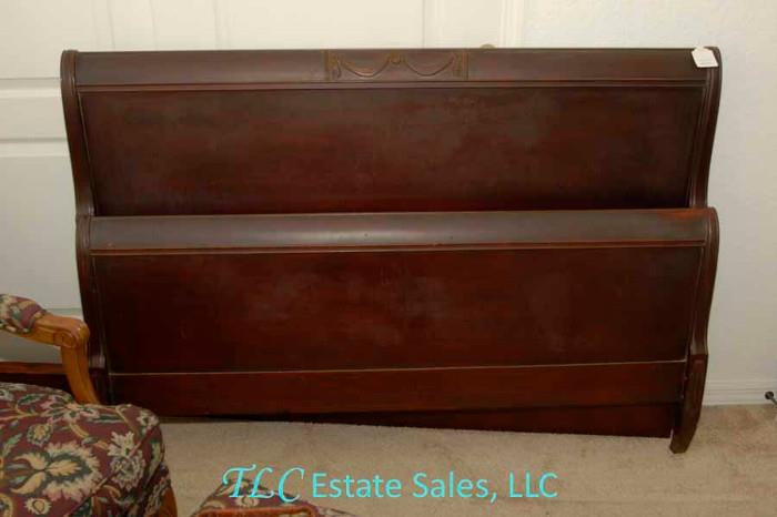 Antique full size sleigh headboard and footboard with exquisite draped scroll accents