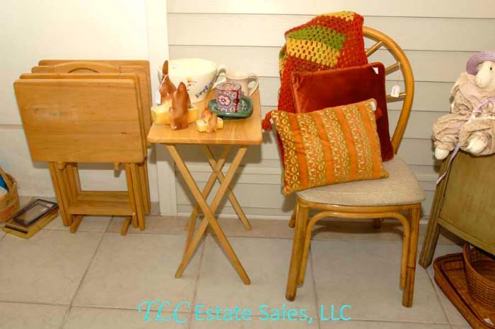 TV trays, chair and decorative pillows.