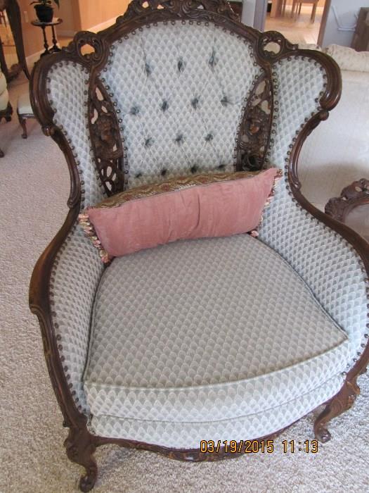 1 of 2 beautiful pierced back wing chairs. Carved and rare