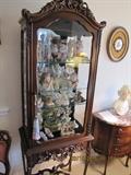 Very unique tall legged curio cabinet