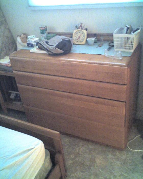 Bedroom set, blonde wood, 1950s era, includes dresser, bed frame, nightstand.