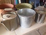 Vintage watering cans and buckets