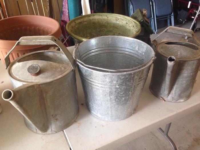 Vintage watering cans and buckets