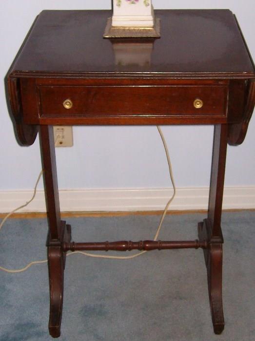 One of a pair of beautiful mahogany drop leaf bedside or chair side tables 