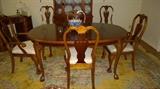 Large dining table with 2 additional leaves, set of 6 matching dining chairs, beautiful golden toned wool rug