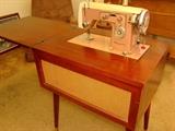 Kenmore Sewing Machine in Wood Cabinet.