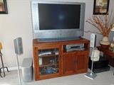 SAMSUNG 40" HDTV, PANASONIC 6 speaker system. ARTS & CRAFTS stand.